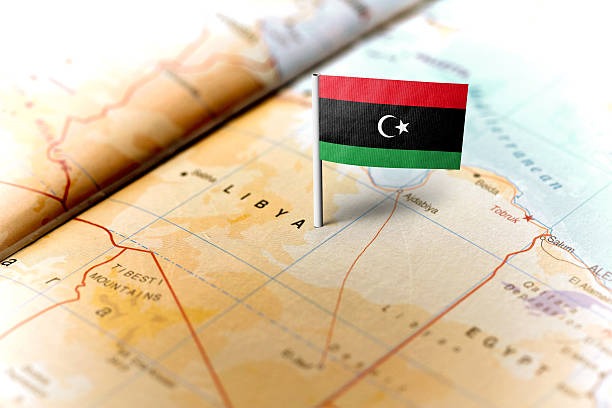 جزء من خريطة وعلم دولة ليبيا